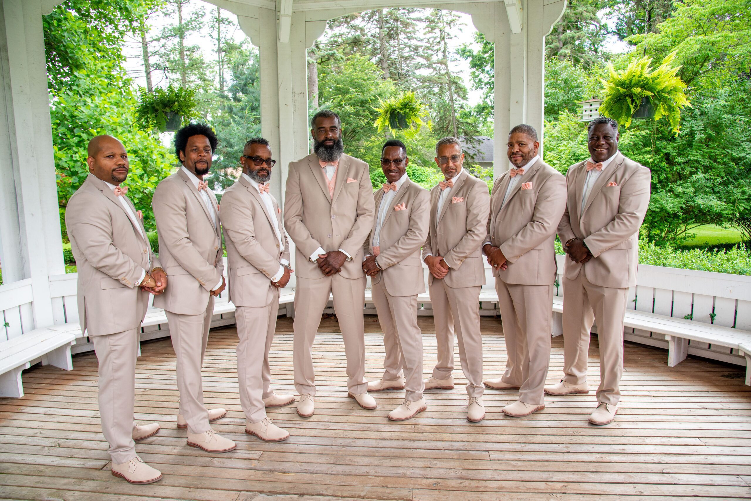 Wedding party in tan suits